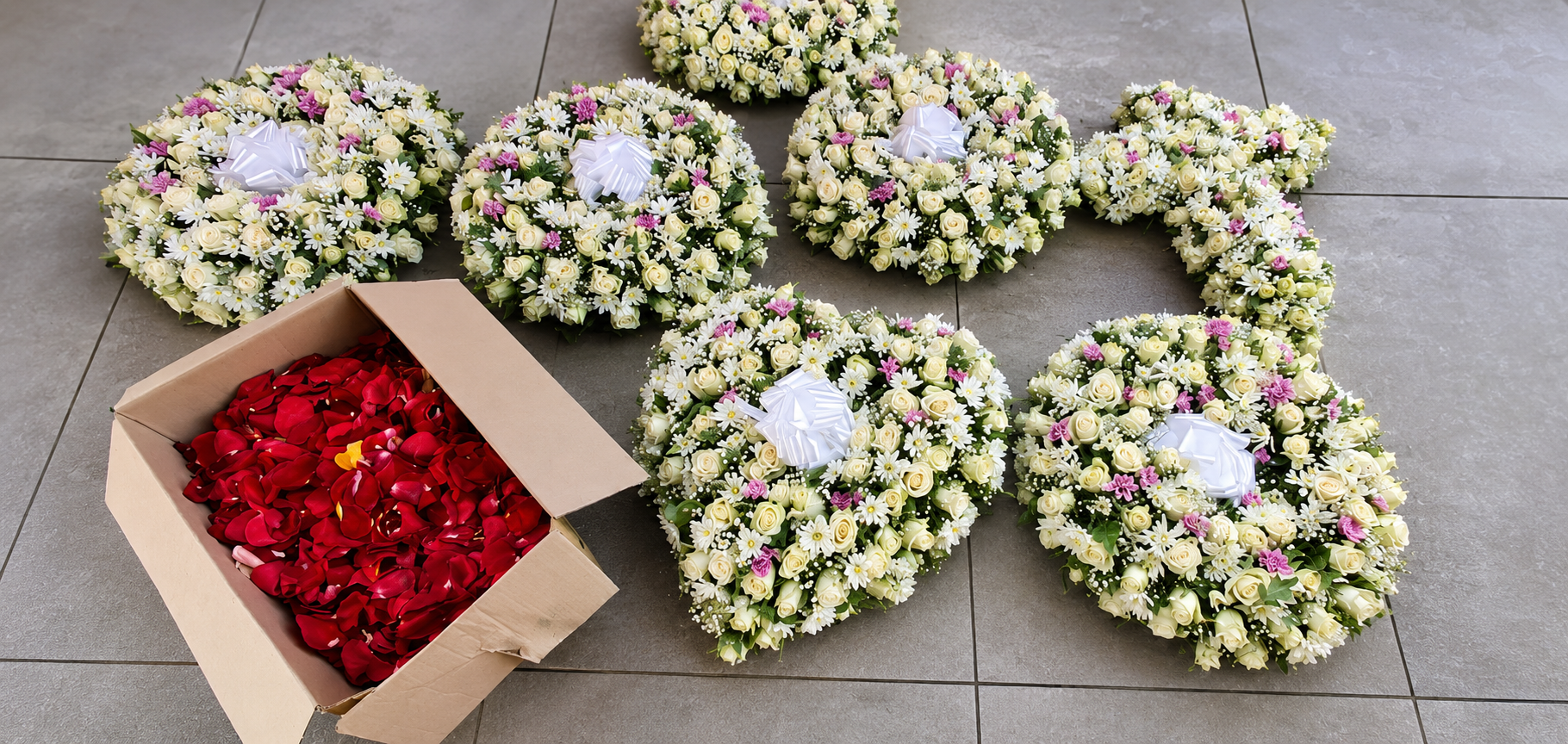 Soft floral wreath arrangement, evoking a peaceful memorial setting